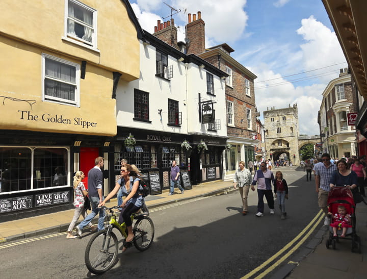 Cycling down a high street