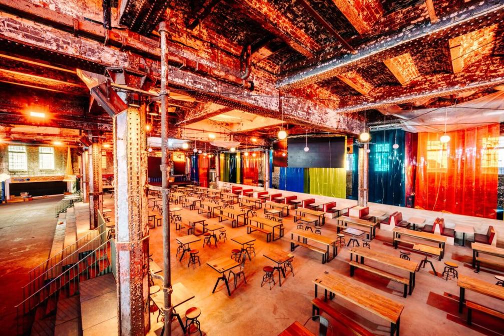 Inside Depot Mayfield, where there are rows of tables