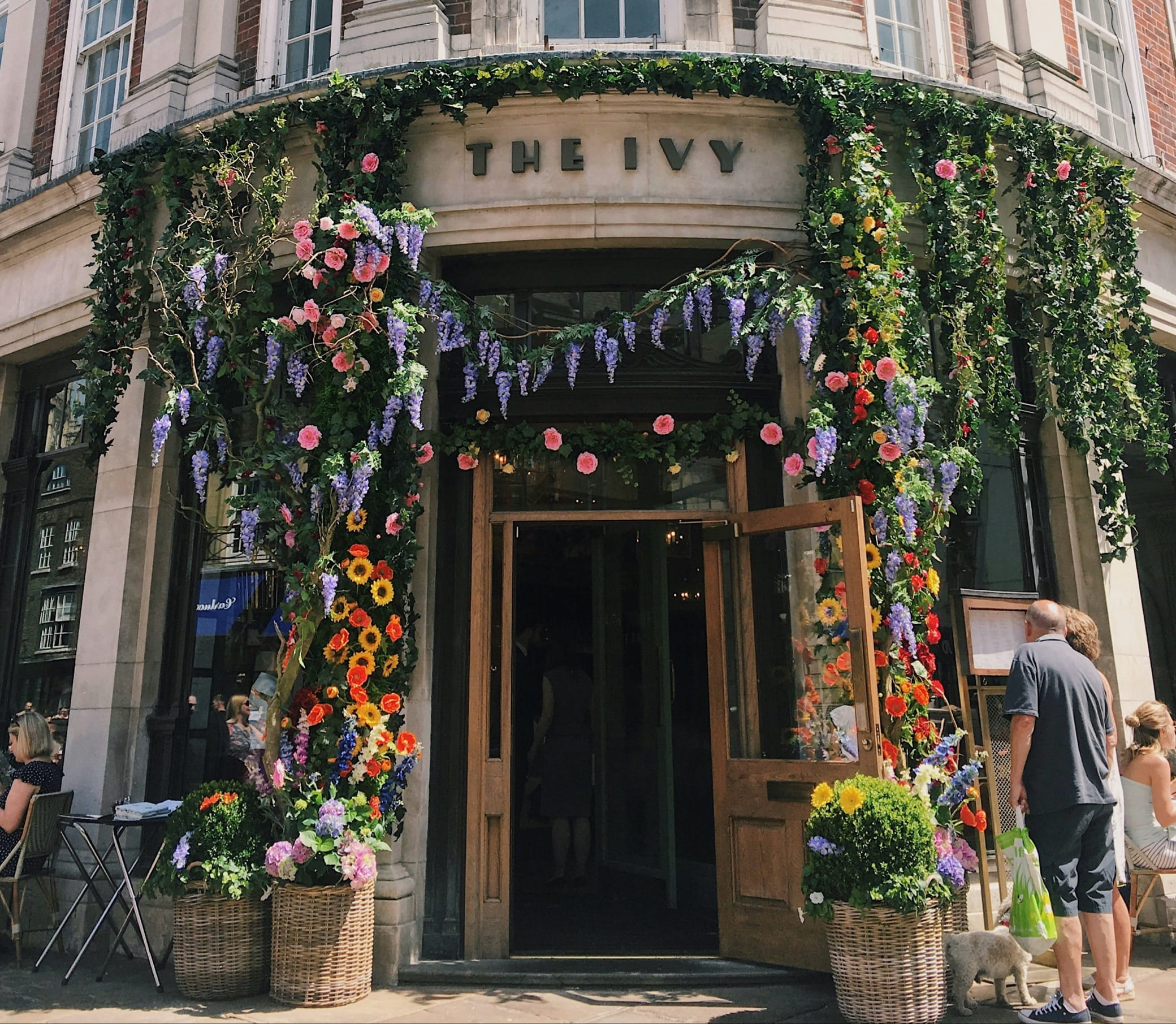 The exterior of the Ivy covered in flowers