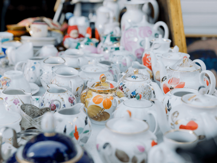 Some painted ceramic teapots on a table