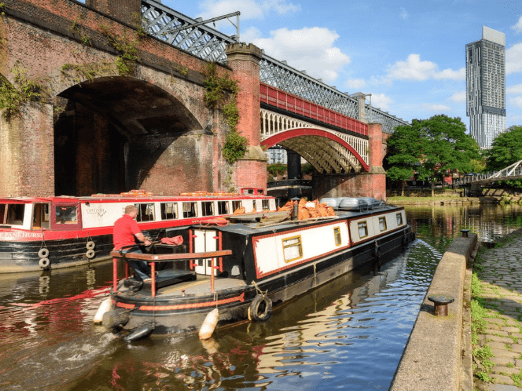 Some canal boats and a bridge at Castlefield in Manchester