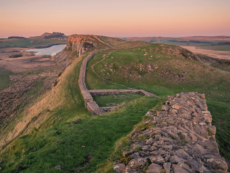 Hadrian's Wall and rolling hills at sunset