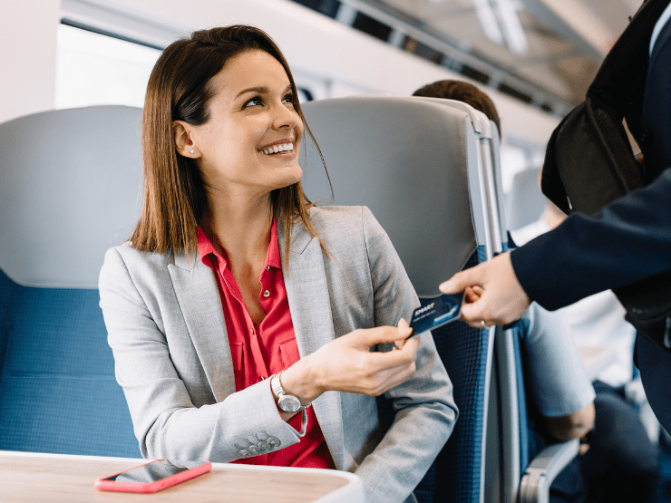 Business customer showing her Smartcard to a TransPennine Express conductor